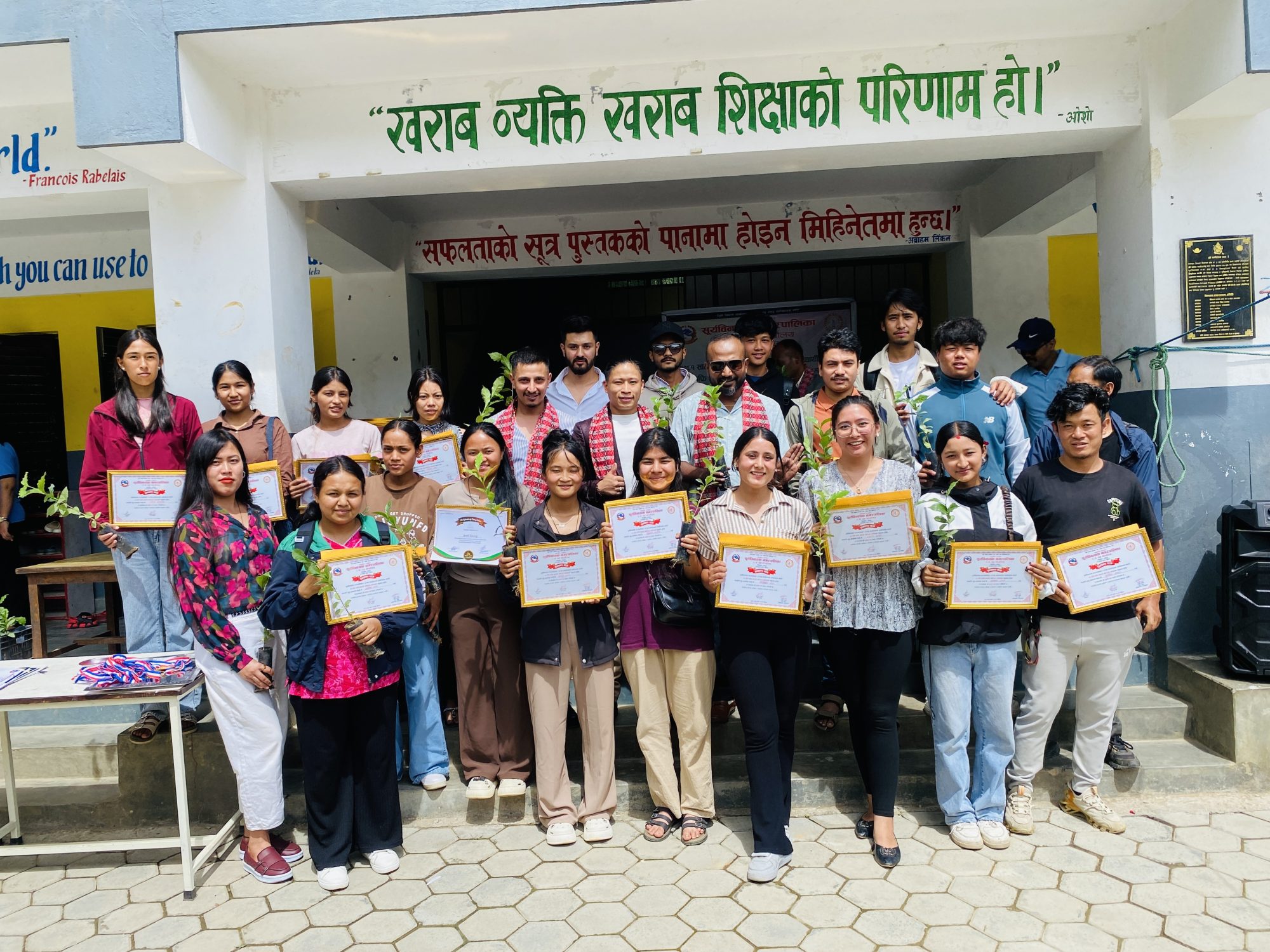 Graduates with their certificates