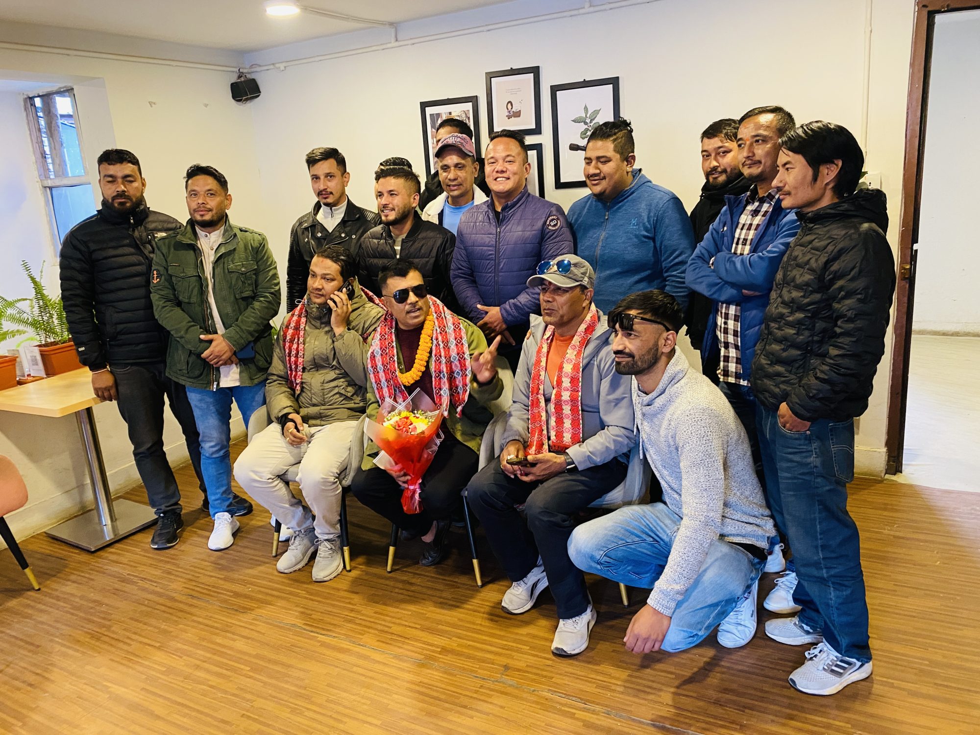 Trainers and guests at the café